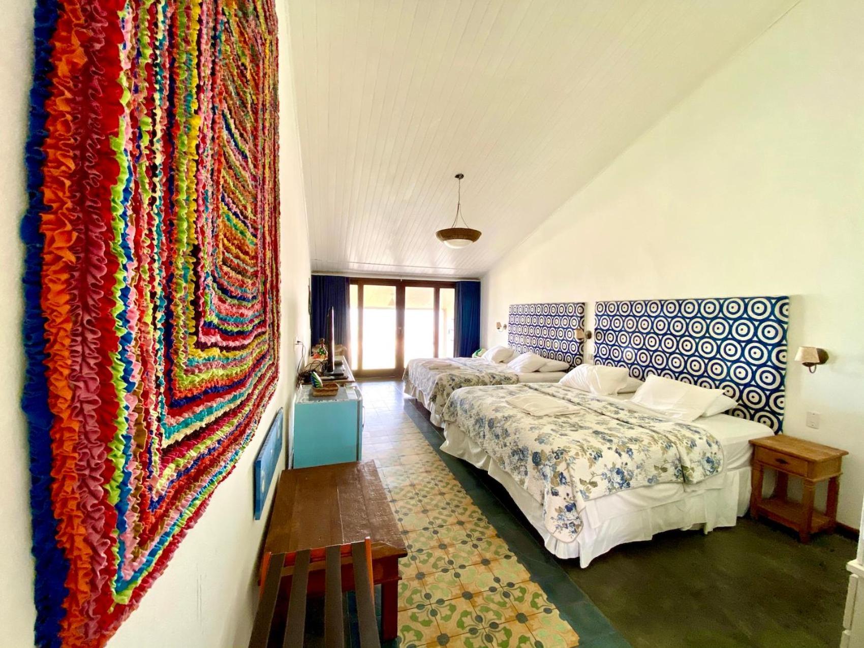 Quarto Quádruplo com Vista do Mar.